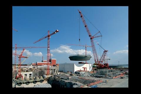 The base of the steel reactor liner being craned into position.